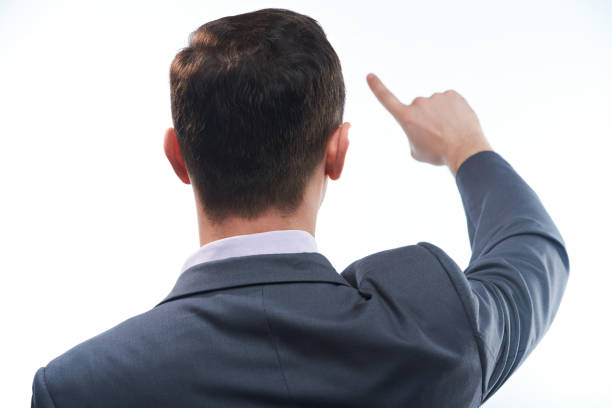 istock Back of man touching space with finger 666369246