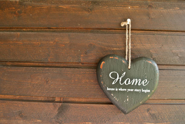 istock Home is where the story begins - Heart shape on a wall 666369350