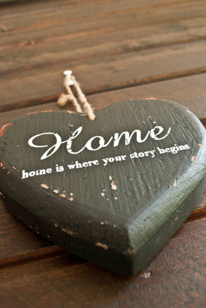 istock Home is where the story begins - Heart shape on a wall 666370052
