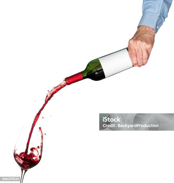 Wine Pouring From Bottle Into Glass Stock Photo - Download Image Now - Pouring, Red Wine, Drinking Glass