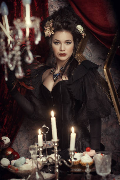 istock Woman in black rococo dress 666370670