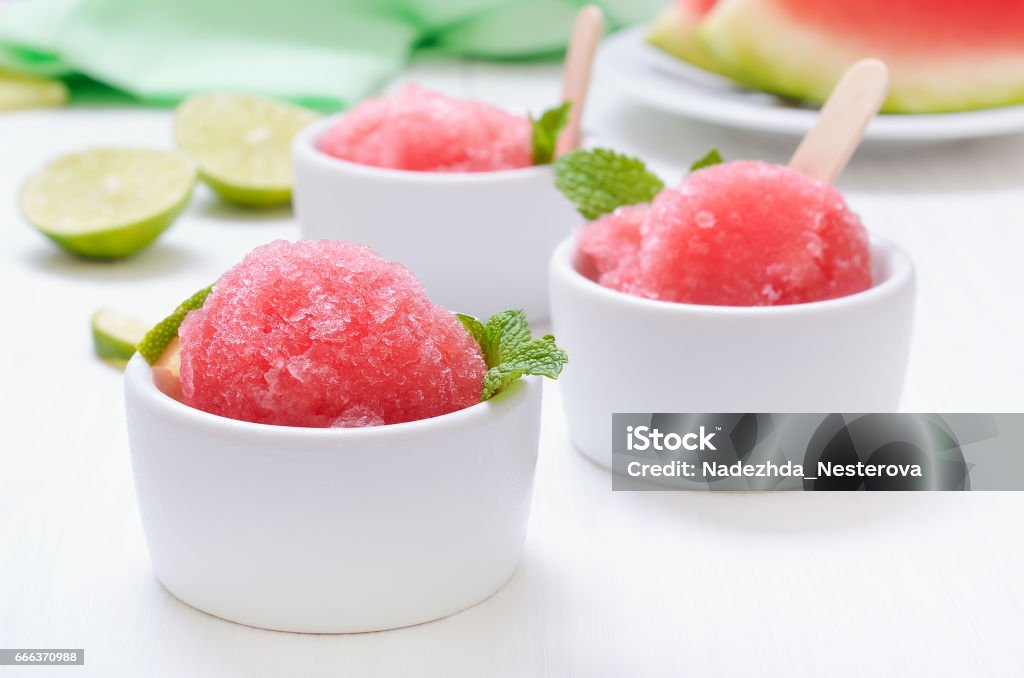 Watermelon sorbet decorated with mint Watermelon sorbet decorated with mint in white bowl Sorbet Stock Photo