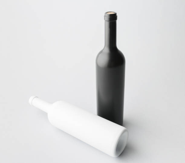 istock Two wine bottle are standing on gray background 666371568