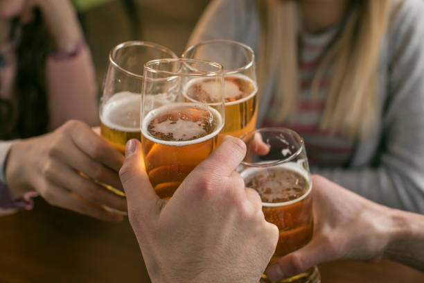 istock A group of friends toasting their drinks at bar 666373570