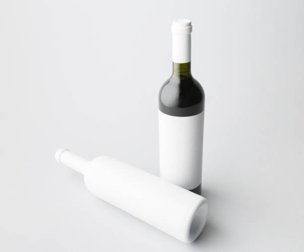 istock Two wine bottle are standing on gray background 666373750