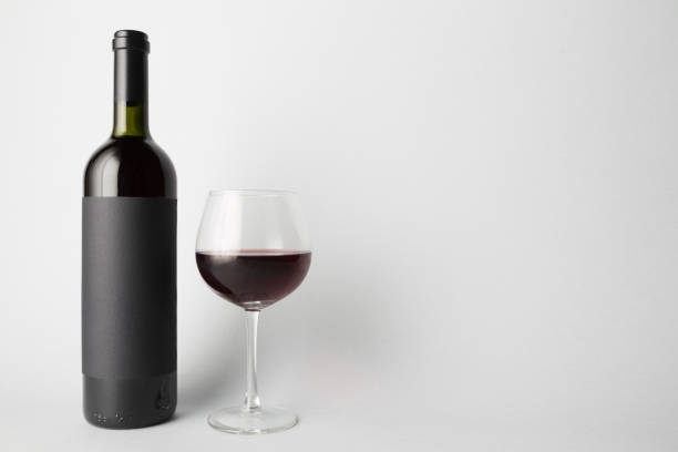 istock Front view of the wine bottle and wine glass 666374474