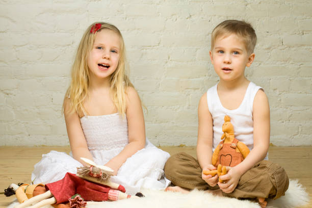 Best friends playing with toys in the bedroom
