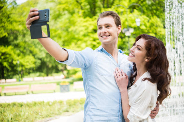 istock Couple taking a selfie portrait 666376320