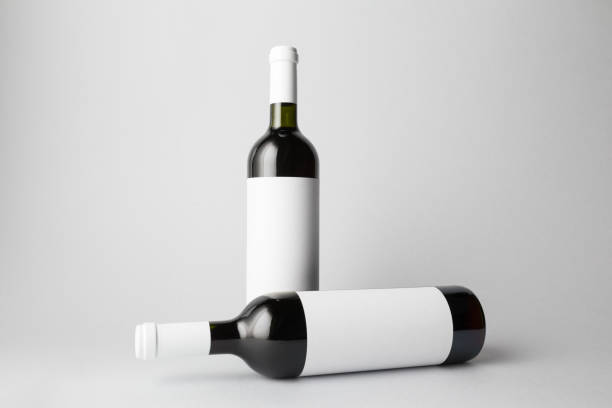 istock Two wine bottles are standing on gray background 666378870