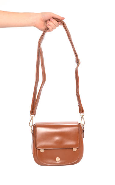 istock brown leather clutch isolated on white 666379324