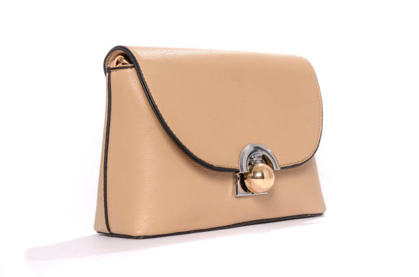 istock Beige leather clutch isolated on white 666379352