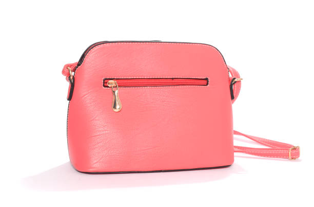 istock pink leather clutch isolated on white 666379356