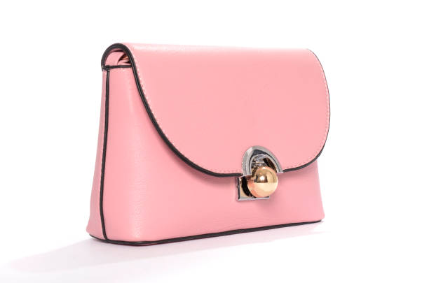 istock Pink leather clutch isolated on white 666379360
