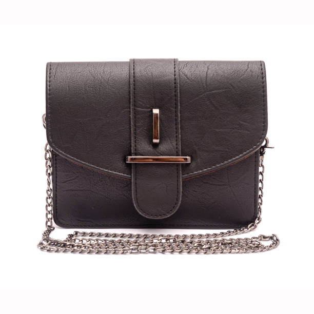 istock Black leather clutch with chain isolated on white 666379432
