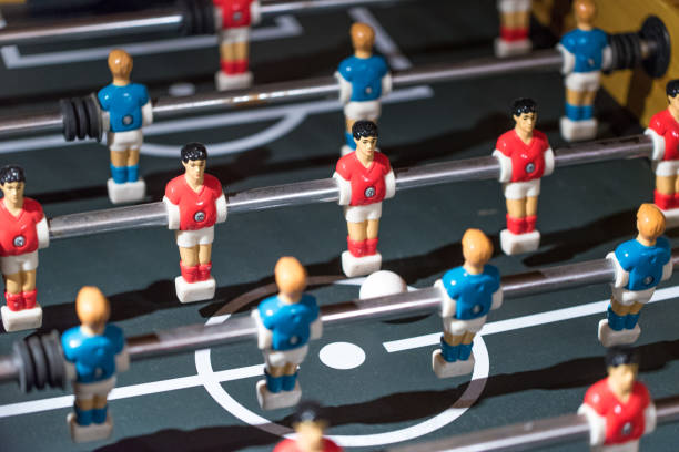 istock Table football kicker with miniature players 666389178