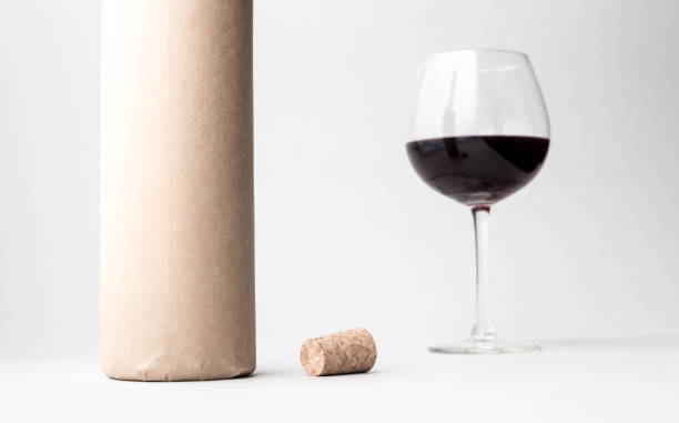 istock Wine bottle and glass on a gray background 666391456