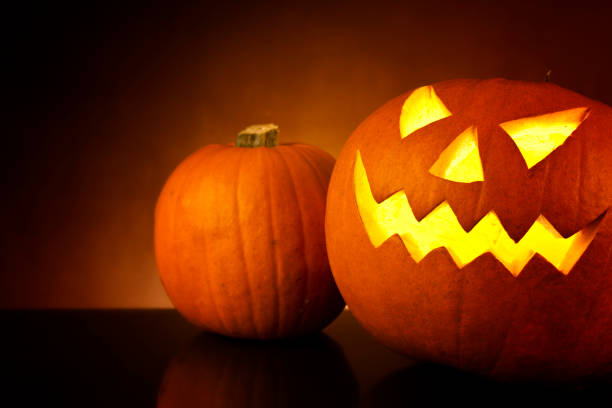 istock illuminated halloween pumpkin jack-o-lantern 666392606