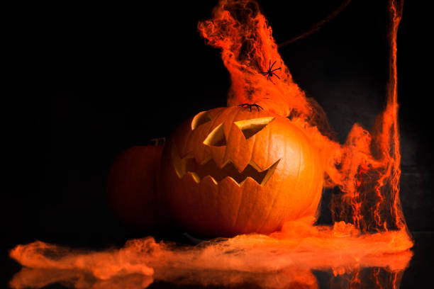 istock illuminated halloween pumpkin jack-o-lantern 666392720