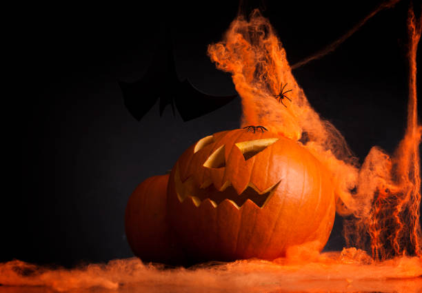 istock illuminated halloween pumpkin jack-o-lantern 666392758