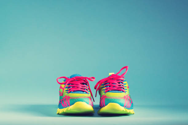 istock Colorful running sneakers on a blue background 666393956