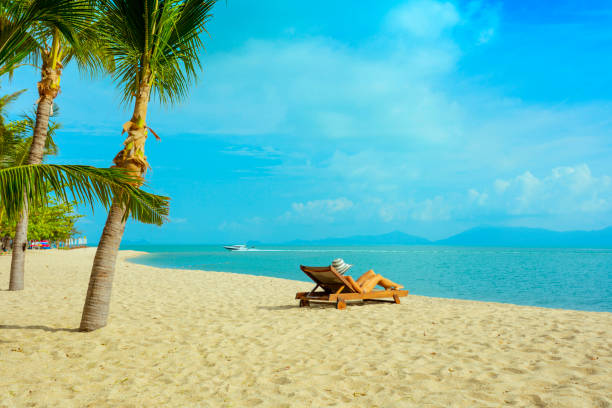 istock Woman in beach chair 666467364