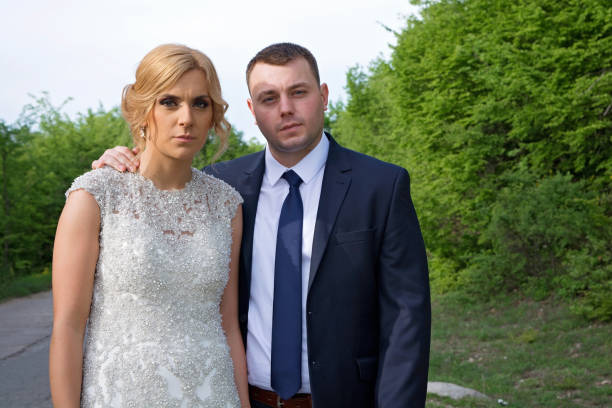 istock Bride and groom embracing in park 666467694