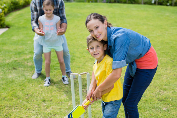 istock Family playing cricket in park 666467754