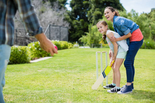 istock Family playing cricket in park 666467786