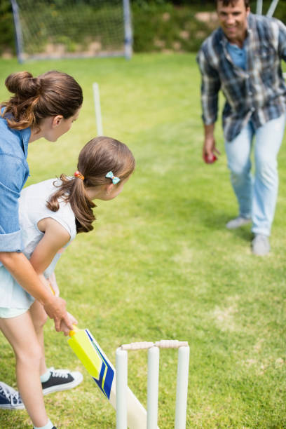istock Family playing cricket in park 666467850