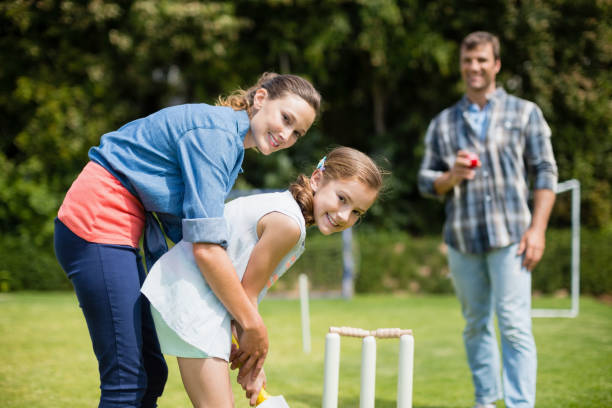 istock Family playing cricket in park 666467906