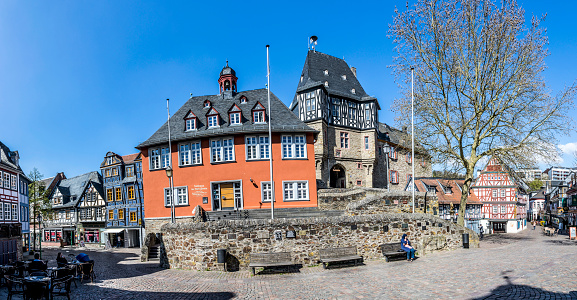 Idstein: people visit scenic half timbered houses and famous Hexenturm in Idstein, Germany.