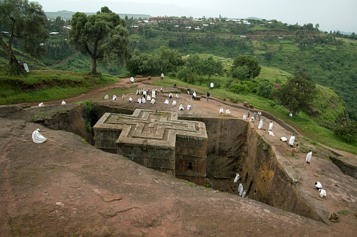 LALIBELA, ETHIOPIA - 26 AUGUST 2007 - Pilgrims gather at the top of a rock hewn church to pray on a sunday. Although services are carried out through out Lalibela each day, Sundays turn out the greatest local crowds. Many of these pilgrims have relocated to lalibela due to its religious roots.