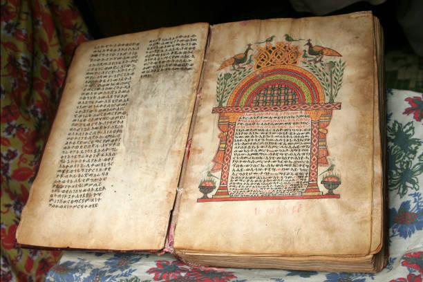 Illistrated bible in Amharic LALIBELA, ETHIOPIA - 28 AUGUST 2007 - A painting inside a rock hewn church. UNESCO have now taken over responsibilities of all Lalibela churches so its arts and artifacts are safe for centuries to come. the church of saint george lalibela ethiopia stock pictures, royalty-free photos & images