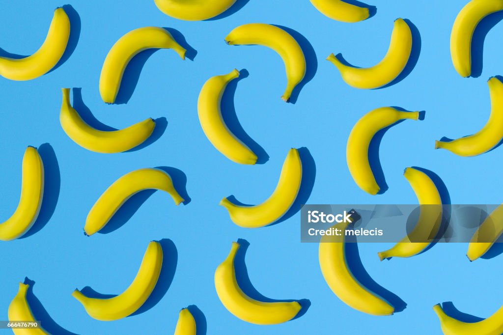 Bananas on blue background Pattern, background, tropical Banana Stock Photo
