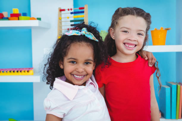istock Cute girls smiling at the camera 666477026