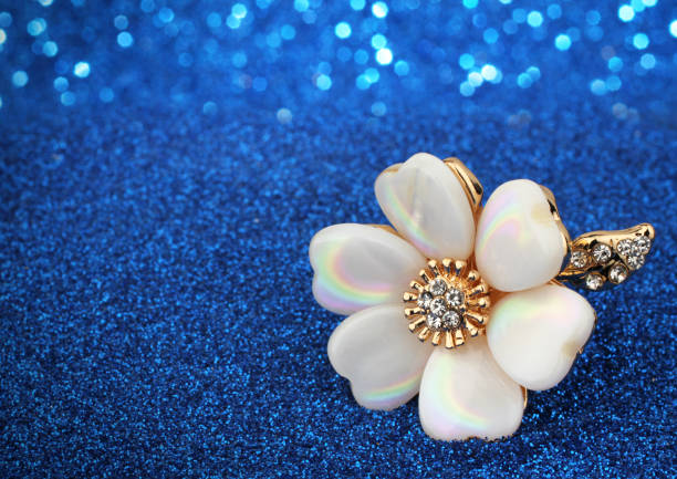 istock jewelry ring with nacre on blue glitter 666477614