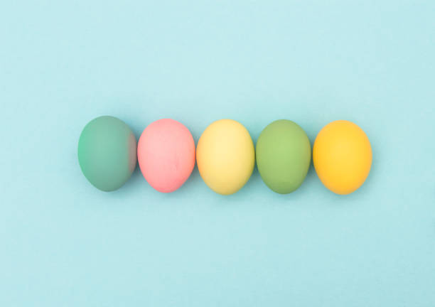 istock Easter eggs blue background Colorful holidays banner 666477702