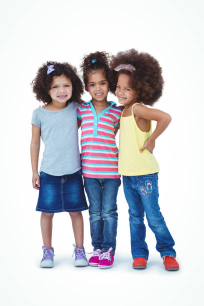 istock Cute girls hugging and looking at camera 666480122