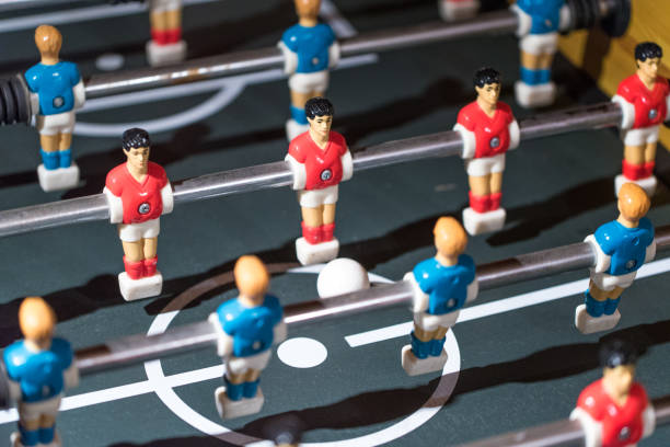 istock Table football kicker with miniature players 666484184