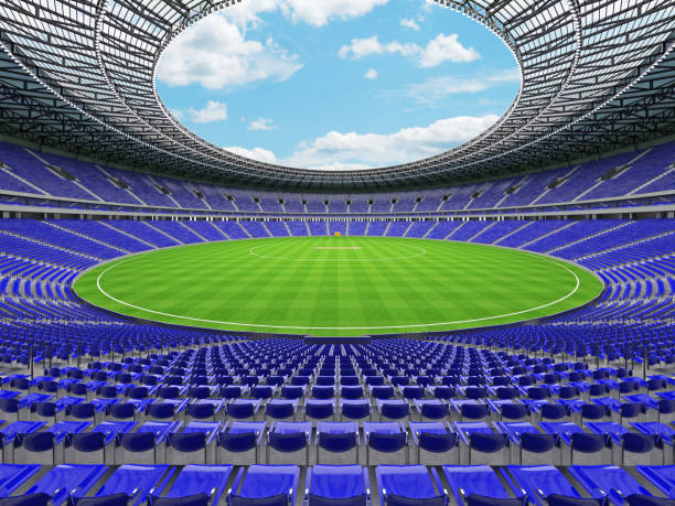 istock 3D render of a round cricket stadium with blue seats and VIP boxes 666486548