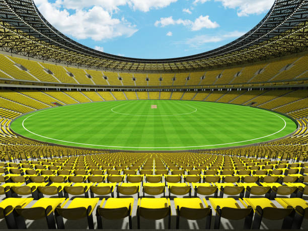 istock 3D render of a round cricket stadium with bright yellow  seats and VIP boxes 666486670