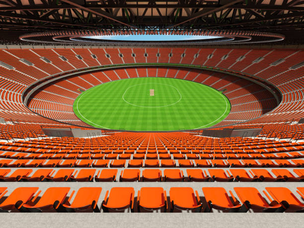 istock 3D render of a round cricket stadium with orange seats and VIP boxes 666486756