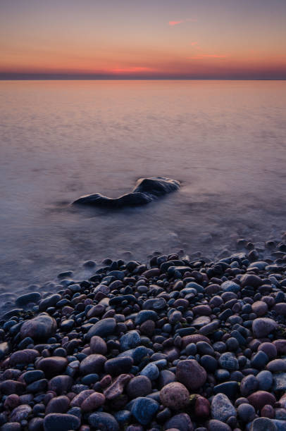 istock The first summer night at the rocky beach. 666489782