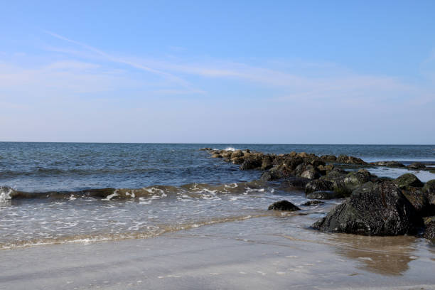 istock Rocky Outcrop on a Coastal Beach 666492568