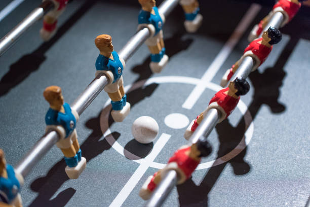 istock Table football kicker with miniature players 666492578
