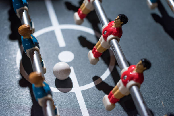 istock Table football kicker with miniature players 666495990