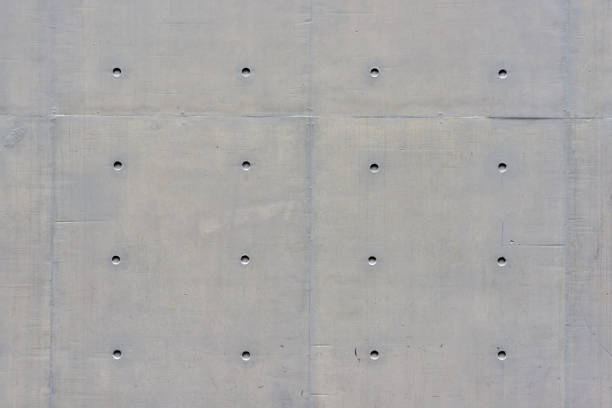 istock Grey concrete wall with holes. As background texture, copy space 666499720