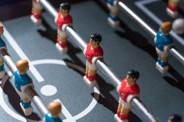 istock Table football kicker with miniature players 666502914