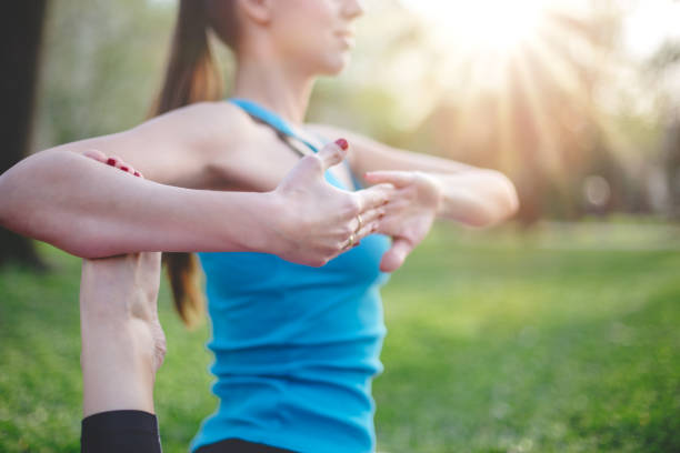 istock Yoga poses and holding hands close up 666504110