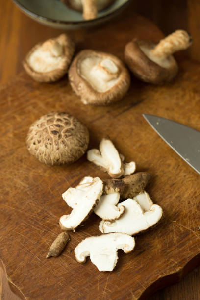 istock Shiitake mushrooms on a wooden table. Selective focus 666506740